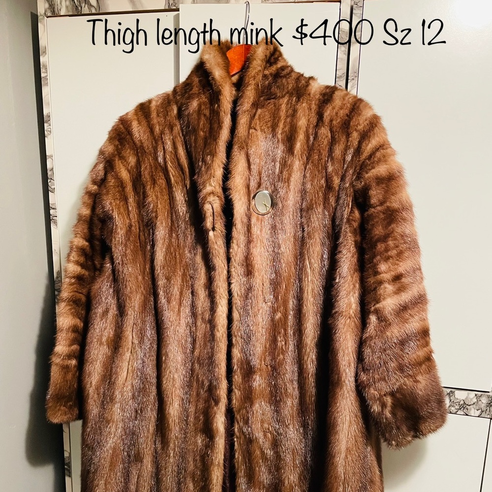 Beautiful brown thigh length mink coat is in very good condition.